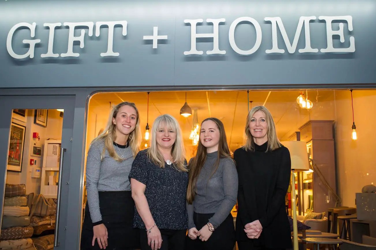 how_it_started Staff in front of the shop